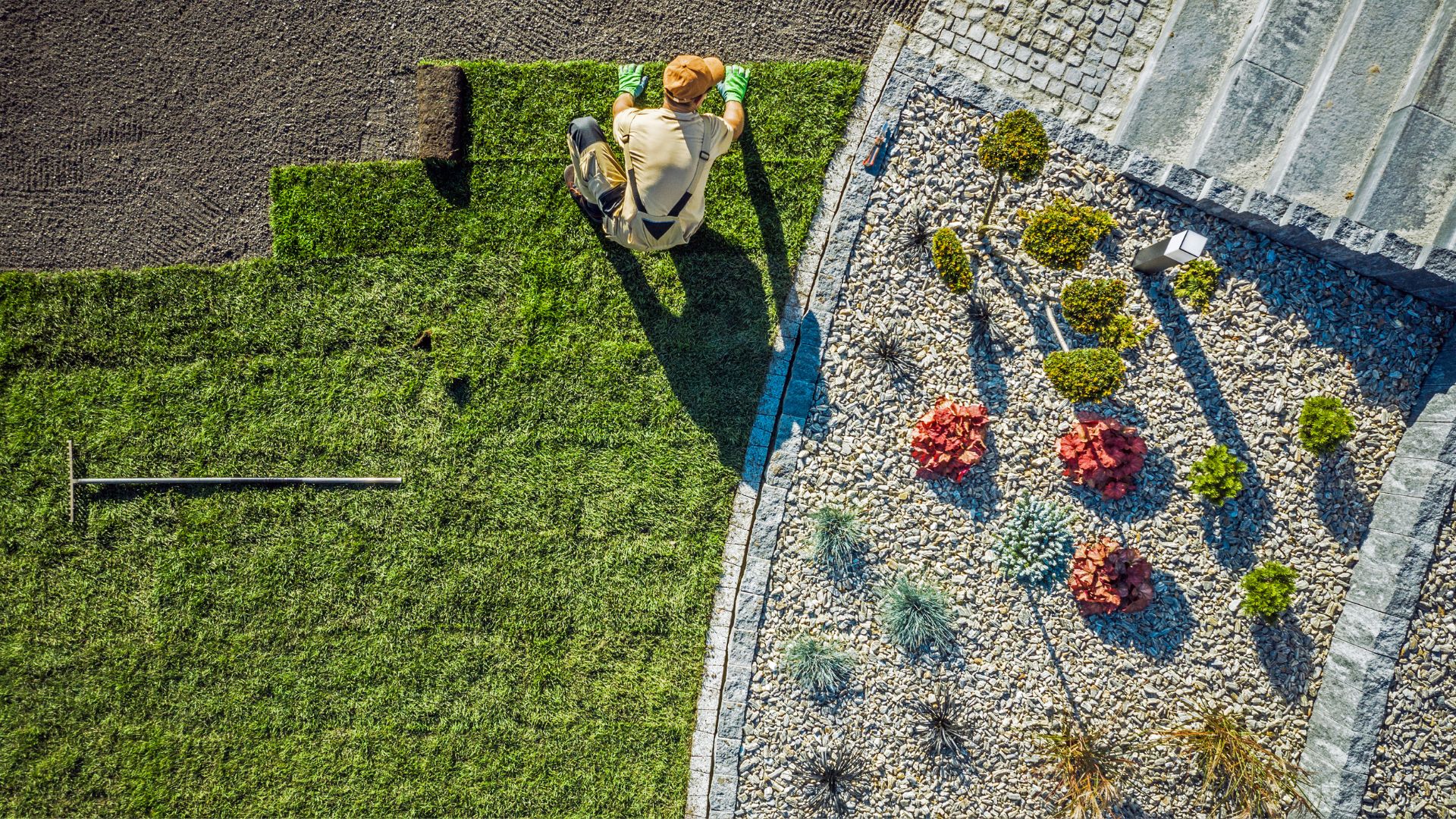 A person sitting on a bench in a garden